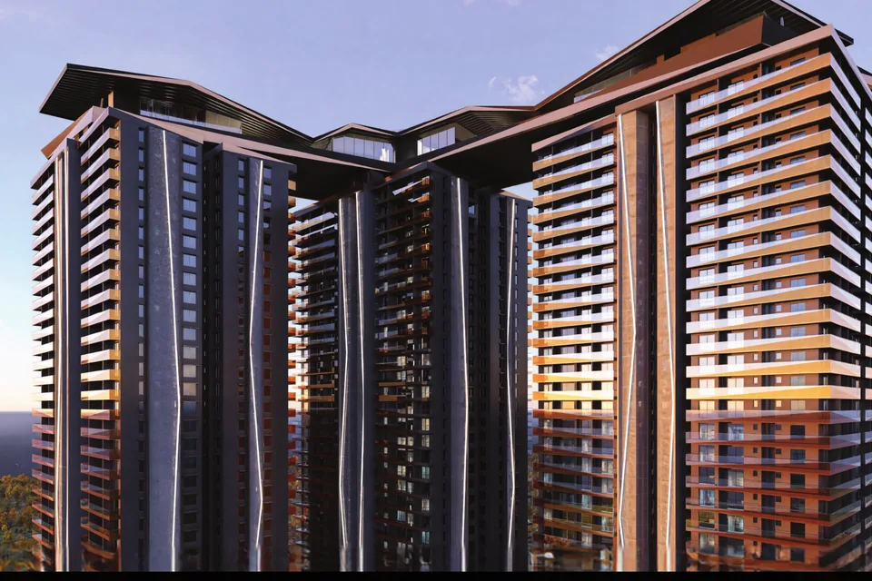 Encanto by Lansum & MK Realty skyline at dusk with the rooftop skybridge crown